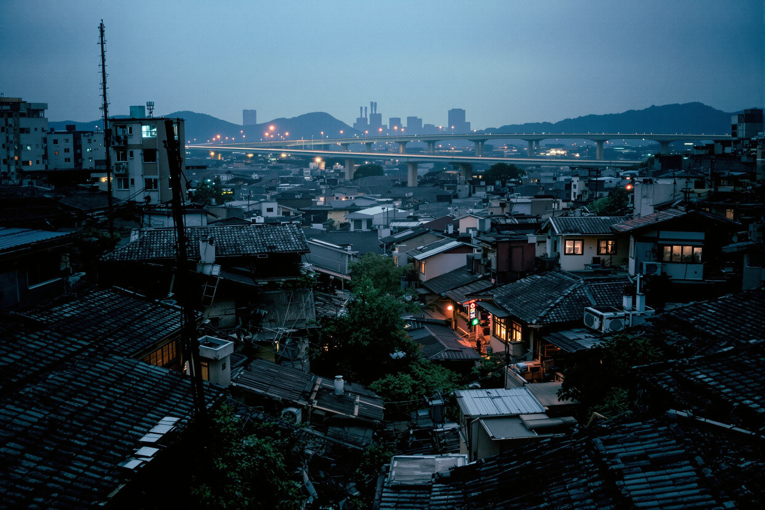 Older Seoul rooftops glowing at dusk